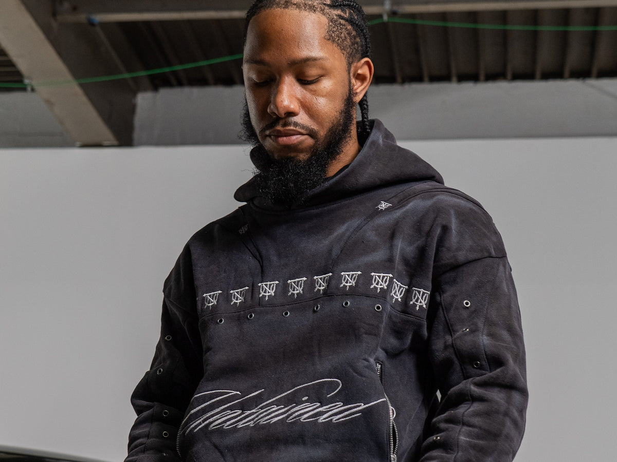 UNTAINED Sinner's Script hoodie worn by a model