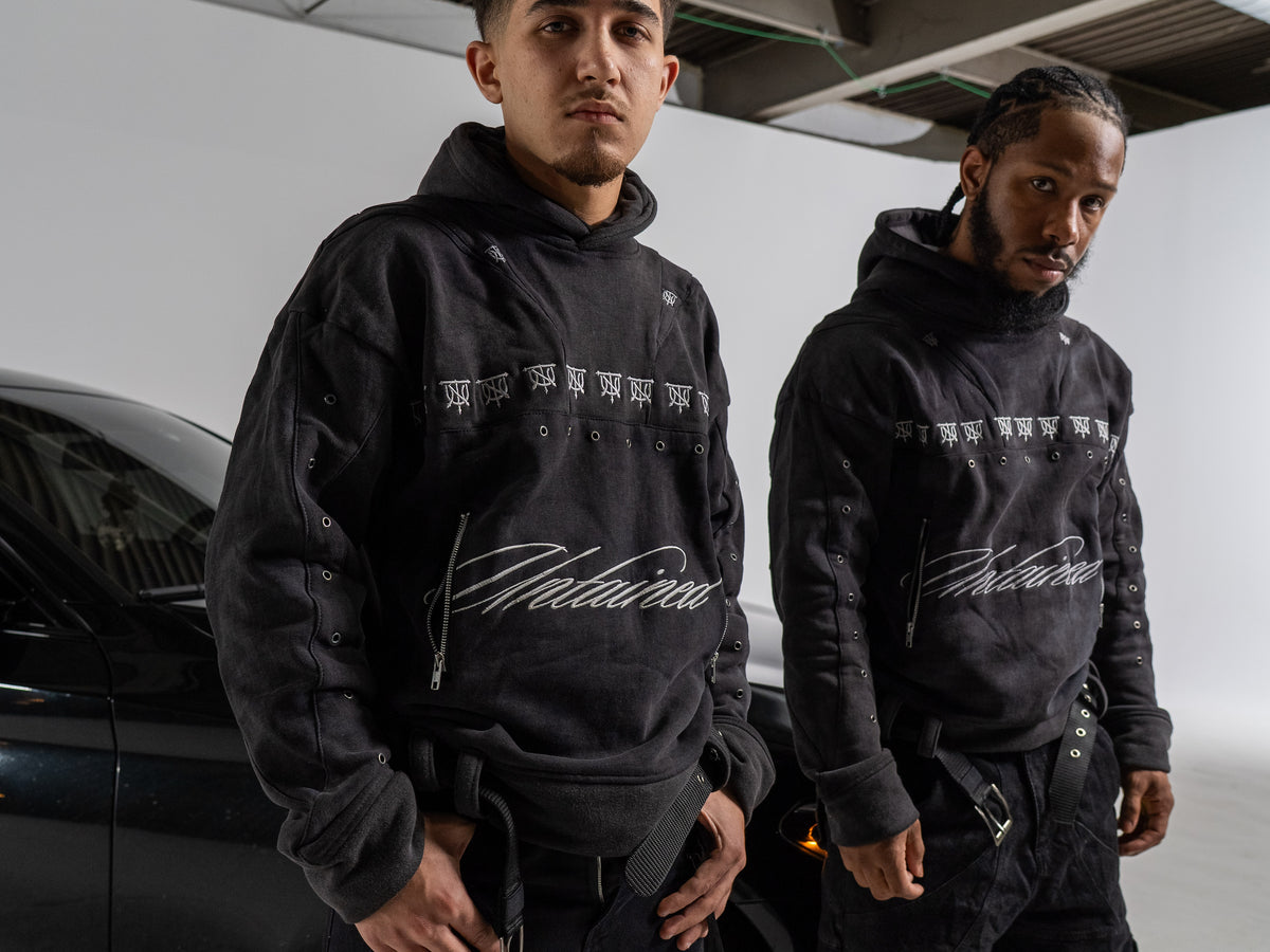 UNTAINED Sinner's Script hoodie worn by a model