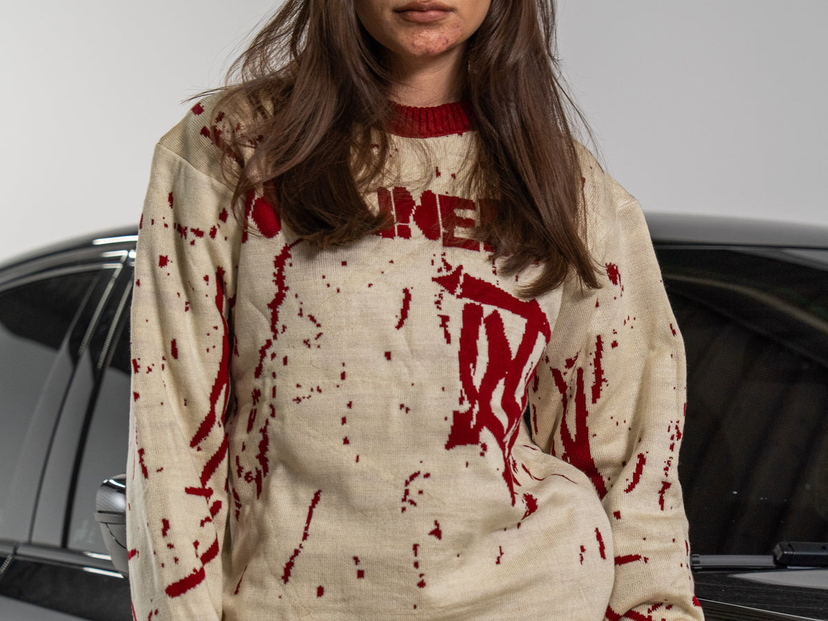 UNTAINED Blood Snow knit sweater worn by a model