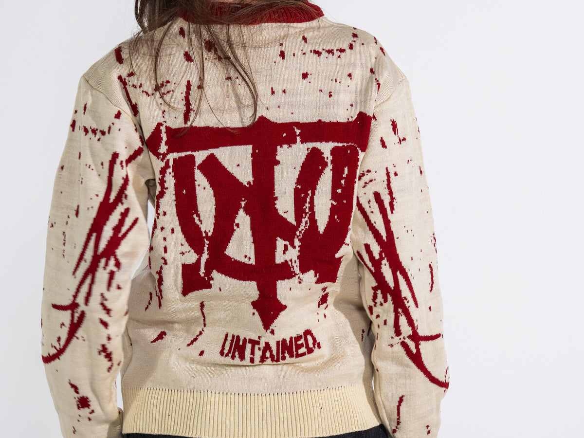 UNTAINED Blood Snow knit sweater worn by a model