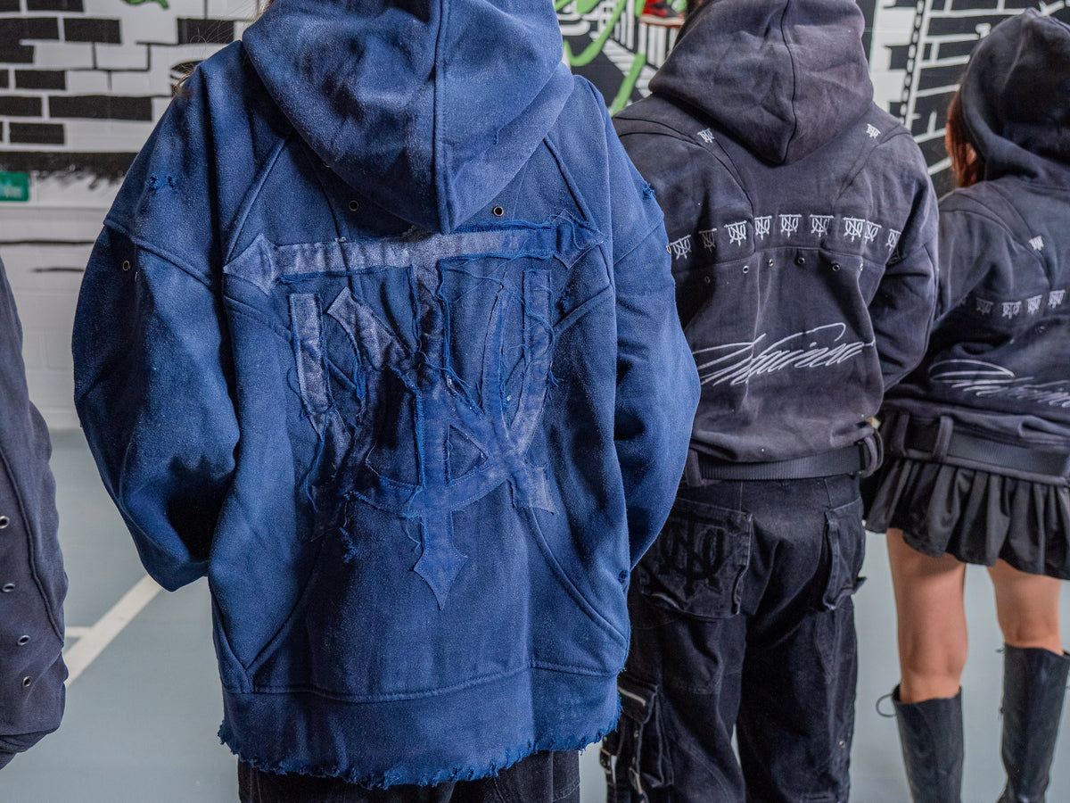 UNTAINED Never Cold hoodie worn by a model